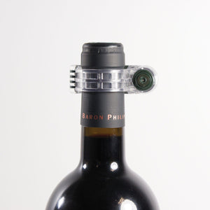 Forstag Wine Tag securely attached to a wine bottle for premium retail protection.
