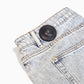 Mitag 50 security tag on garment, discreet theft prevention for retail.