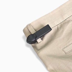 Mitag Clip Tag attached to a jeans belt loop – ideal for securing apparel without damaging fabric.