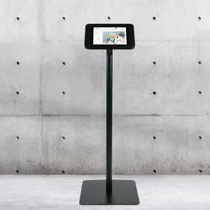 iPad securely displayed on Tab Secure Floorstand with tilt adjustment for customer interaction and glare reduction.