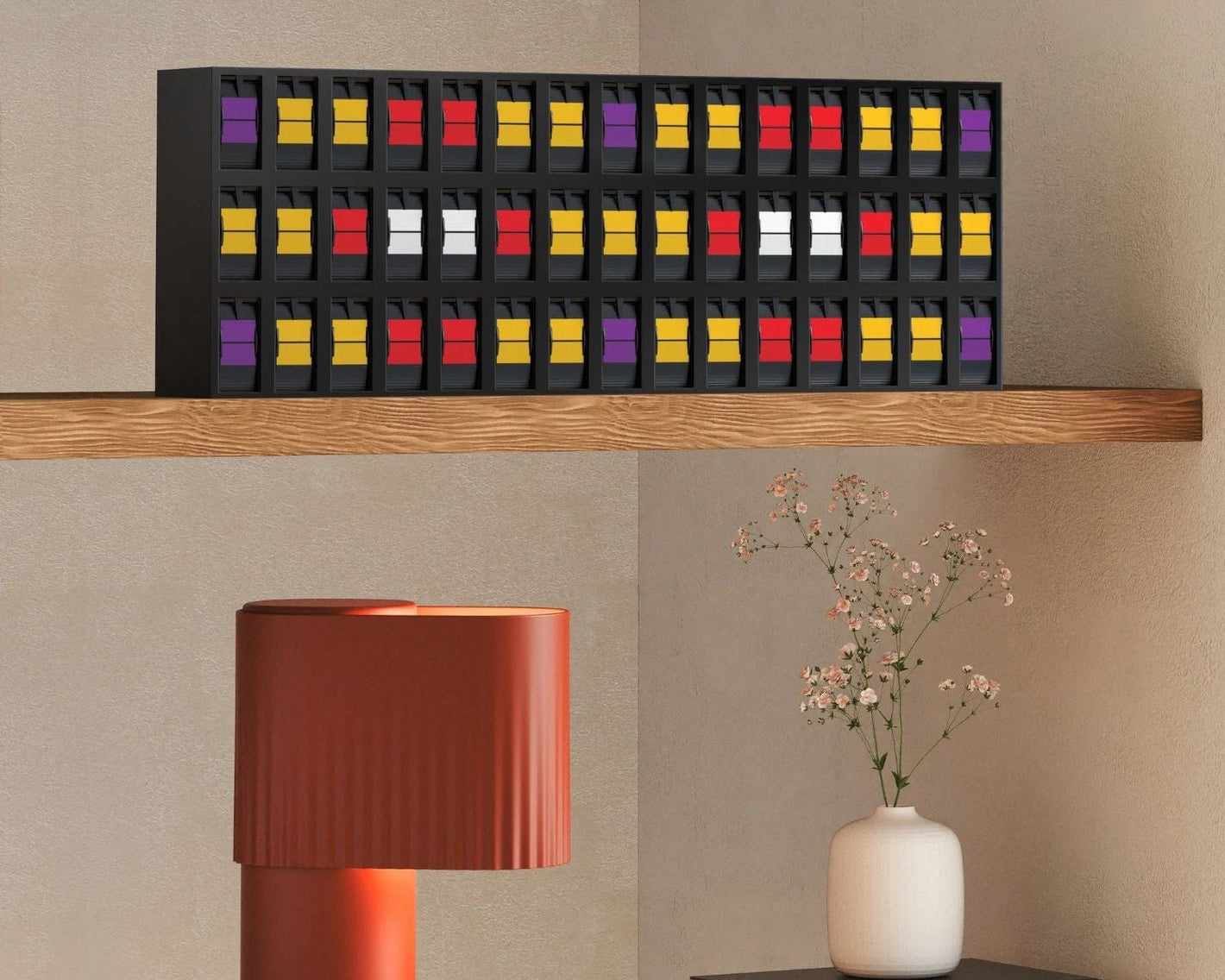 Vestaboard Note sitting on shelf with home decor
