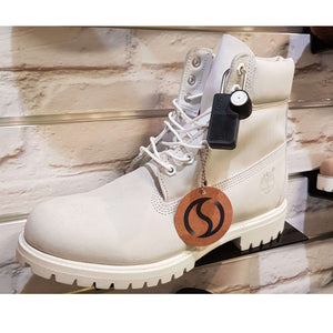 Forstag Padlock Tag securely attached to a shoe for discreet retail protection.